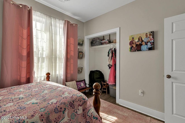 1560 White Oak River Rd, Maysville, NC 28555 - bedroom featuring wood finished floors, baseboards, and a closet