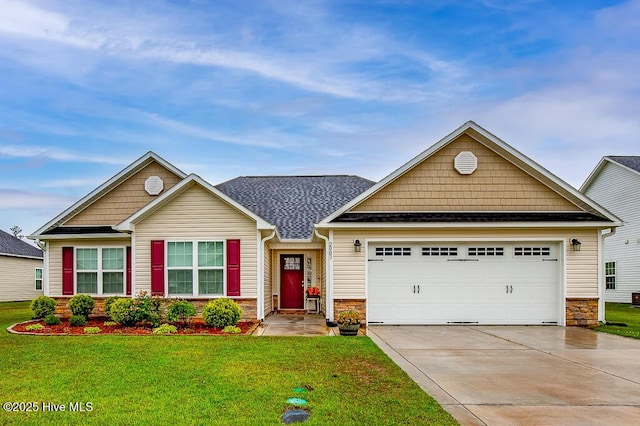 craftsman inspired home with stone siding, a garage, driveway, and a front lawn