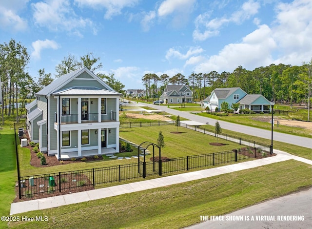 502 Sheldrake Ct, Beaufort, NC 28516 - view of front of property featuring covered porch, a balcony, a fenced front yard, a metal roof, and a residential view