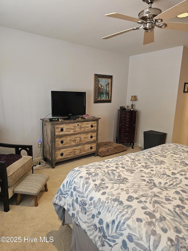carpeted bedroom featuring a ceiling fan