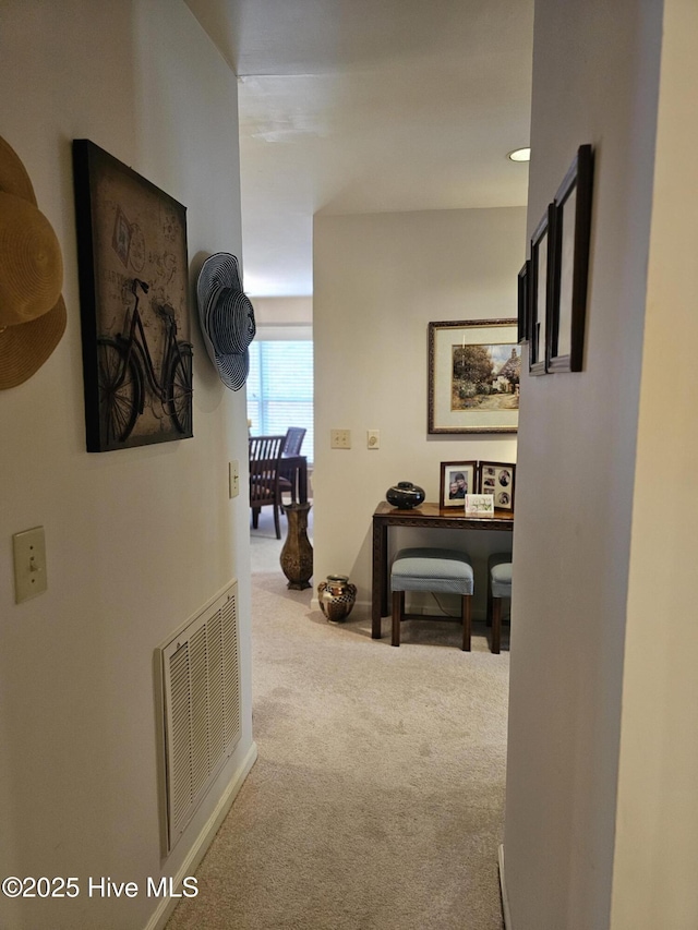 corridor with carpet floors and visible vents