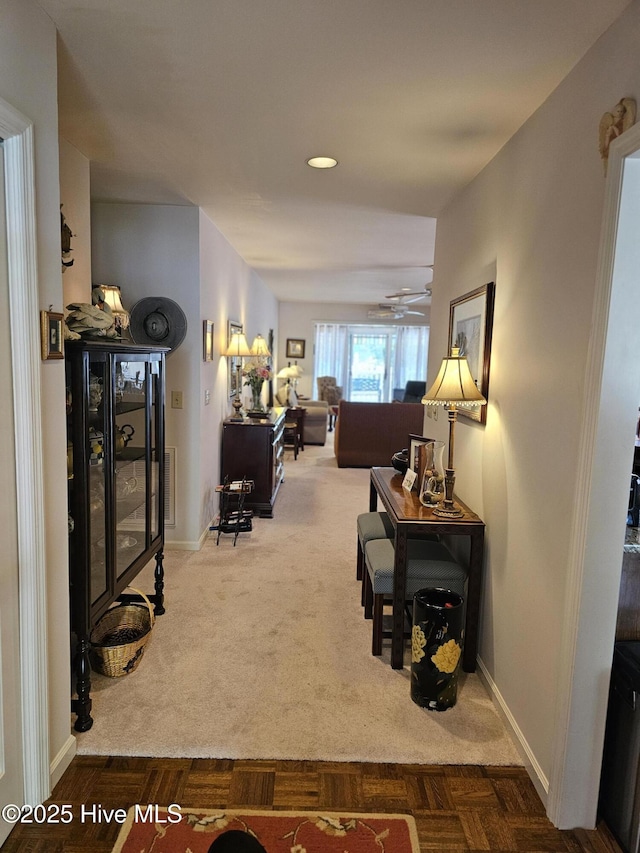 hall with baseboards, carpet flooring, and recessed lighting