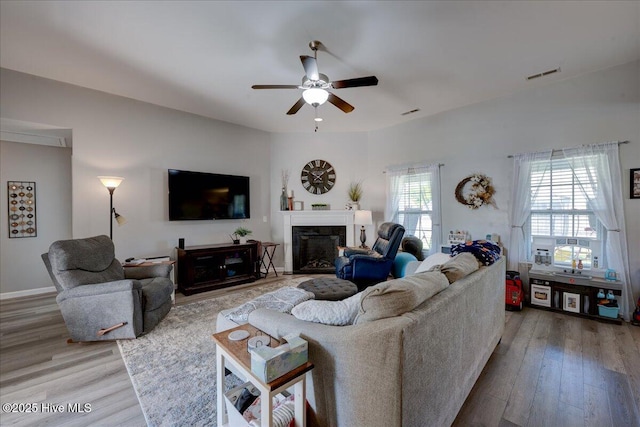 115 Kenmore Ct, New Bern, NC 28560 - living room with a fireplace, wood finished floors, visible vents, and ceiling fan