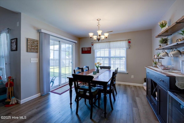 115 Kenmore Ct, New Bern, NC 28560 - dining area with dark wood finished floors, an inviting chandelier, baseboards, and plenty of natural light