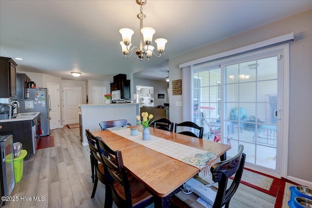 115 Kenmore Ct, New Bern, NC 28560 - dining room with an inviting chandelier and light wood finished floors