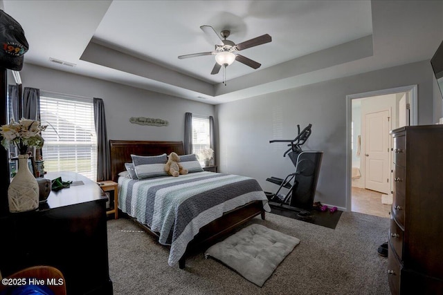 115 Kenmore Ct, New Bern, NC 28560 - carpeted bedroom featuring a raised ceiling, visible vents, and a ceiling fan