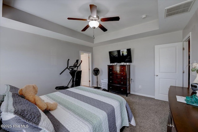 115 Kenmore Ct, New Bern, NC 28560 - carpeted bedroom featuring ceiling fan, baseboards, visible vents, and a raised ceiling