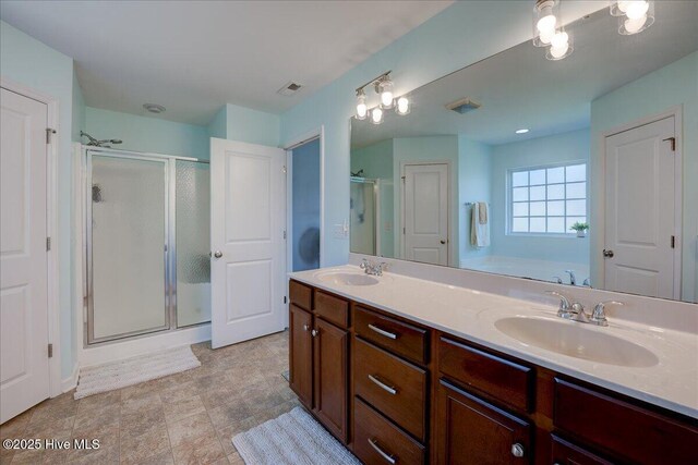 115 Kenmore Ct, New Bern, NC 28560 - bathroom with visible vents, a stall shower, and a sink