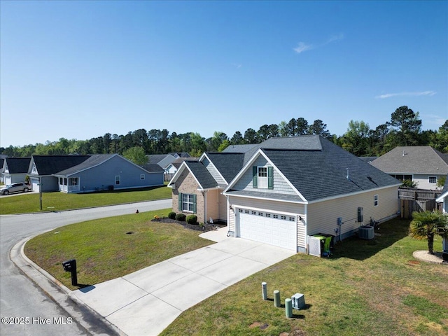 115 Kenmore Ct, New Bern, NC 28560 - traditional-style house with a residential view, driveway, central AC, an attached garage, and a front yard