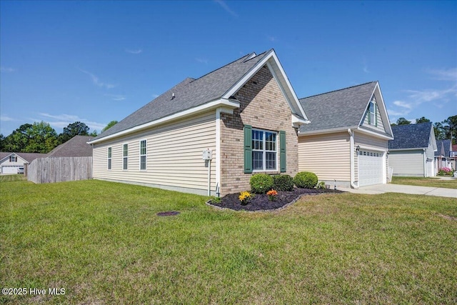 115 Kenmore Ct, New Bern, NC 28560 - view of side of home featuring brick siding, fence, a yard, and driveway