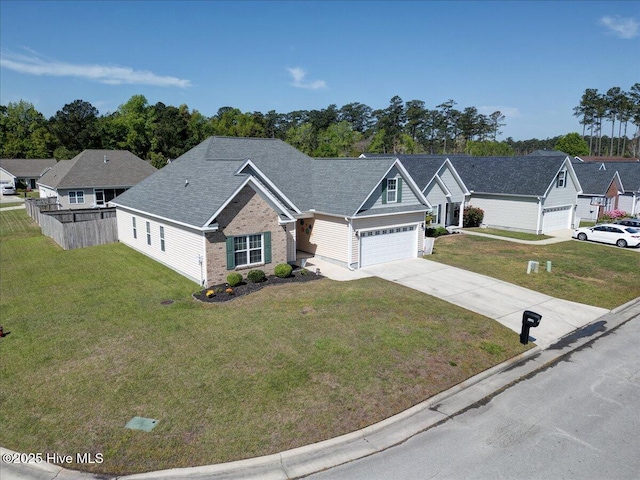 115 Kenmore Ct, New Bern, NC 28560 - view of front of home featuring a front lawn, driveway, fence, brick siding, and a shingled roof