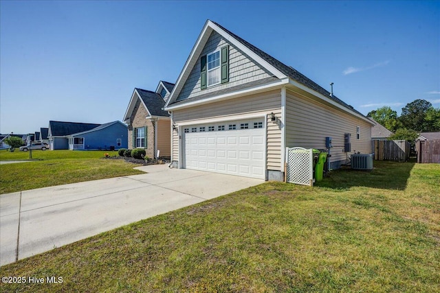 115 Kenmore Ct, New Bern, NC 28560 - view of home's exterior with central AC unit, fence, driveway, a lawn, and a garage