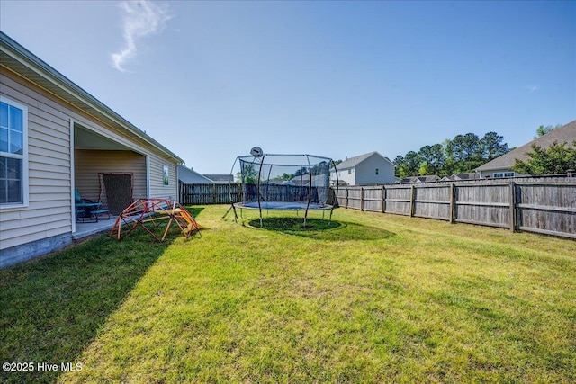115 Kenmore Ct, New Bern, NC 28560 - view of yard featuring a fenced backyard and a trampoline