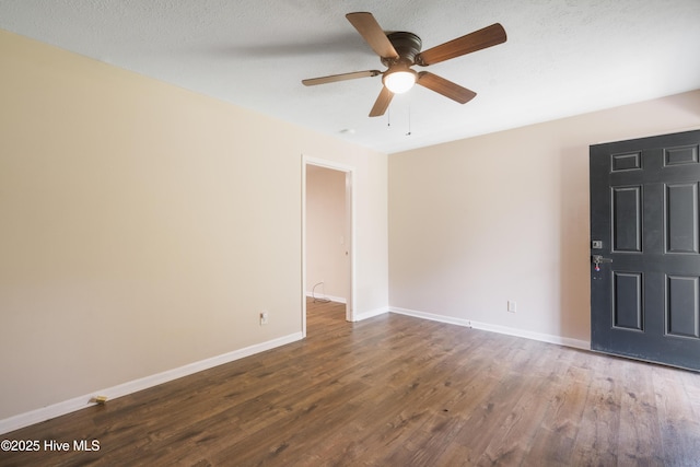 1507 Brookfield Rd, Rockingham, NC 28379 - empty room featuring a ceiling fan, dark wood-style flooring, and a textured ceiling