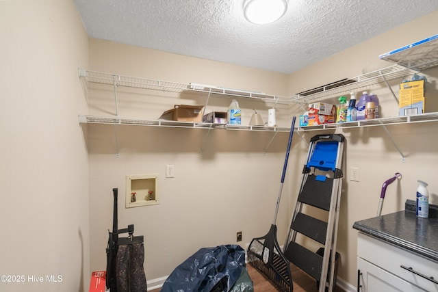 1507 Brookfield Rd, Rockingham, NC 28379 - laundry room featuring hookup for a washing machine and a textured ceiling