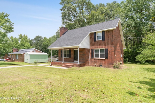 1507 Brookfield Rd, Rockingham, NC 28379 - view of front facade with a shed, brick siding, a front lawn, and a chimney
