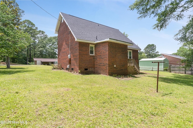 1507 Brookfield Rd, Rockingham, NC 28379 - view of home's exterior featuring a shingled roof, crawl space, and brick siding
