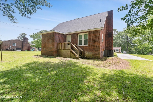 1507 Brookfield Rd, Rockingham, NC 28379 - view of front of house with brick siding, a front lawn, and a shingled roof