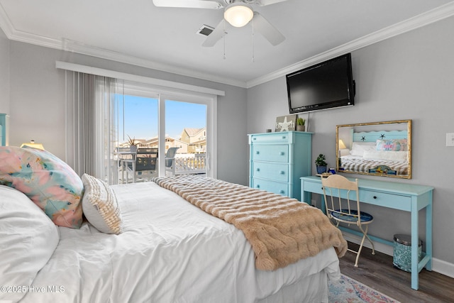 bedroom with crown molding, ceiling fan, visible vents, wood finished floors, and baseboards