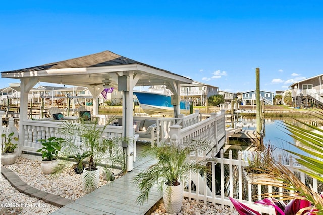 dock area with a water view and boat lift