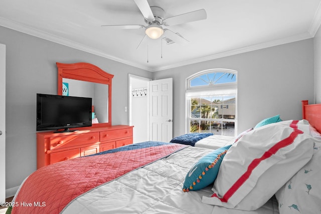 bedroom with crown molding and ceiling fan