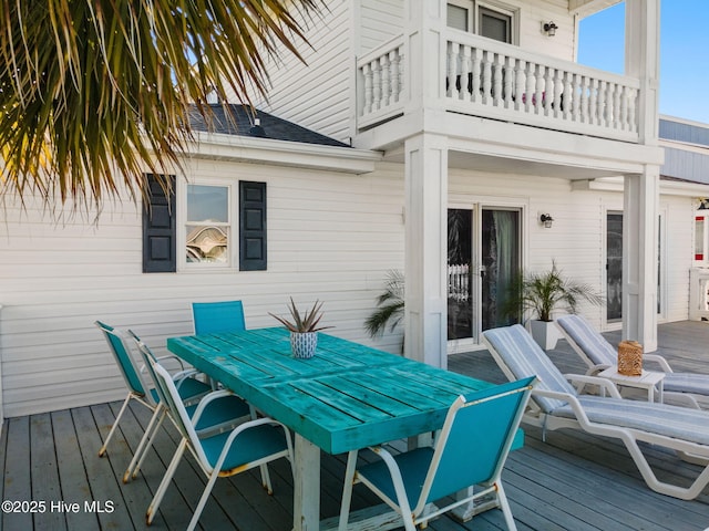 wooden deck featuring outdoor dining space