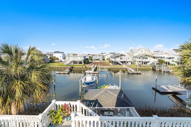 view of dock featuring a water view and a residential view