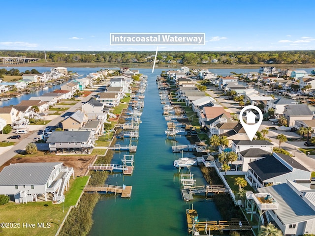 bird's eye view with a water view and a residential view