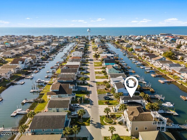 aerial view with a water view and a residential view