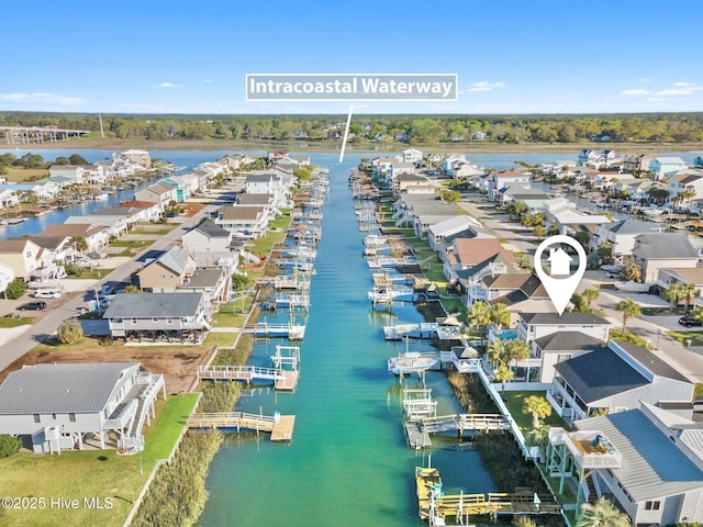 drone / aerial view with a water view and a residential view