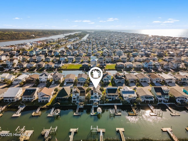 bird's eye view featuring a water view and a residential view