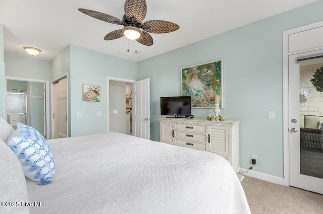 1135 Park Rd SW Unit 1203, Sunset Beach, NC 28468 - bedroom with light carpet, baseboards, ensuite bath, and ceiling fan