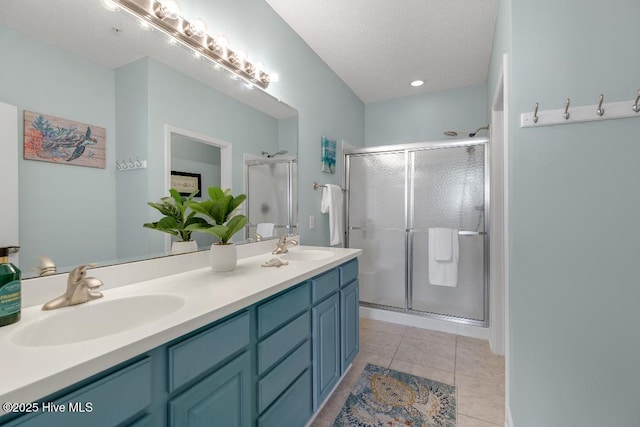 1135 Park Rd SW Unit 1203, Sunset Beach, NC 28468 - full bathroom with double vanity, a shower stall, and tile patterned flooring
