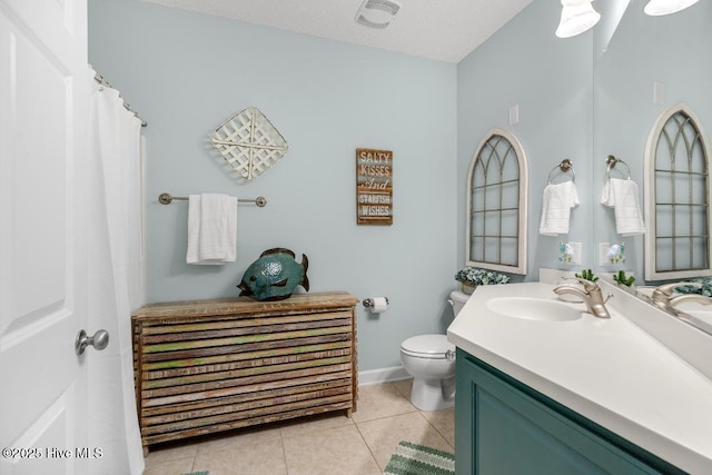 1135 Park Rd SW Unit 1203, Sunset Beach, NC 28468 - bathroom with toilet, vanity, tile patterned flooring, and baseboards