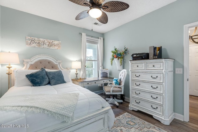 1135 Park Rd SW Unit 1203, Sunset Beach, NC 28468 - bedroom featuring wood finished floors, baseboards, and ceiling fan