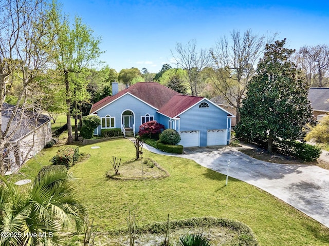 178 Edgewater Cir, Sunset Beach, NC 28468 - mediterranean / spanish home featuring a shingled roof, a garage, driveway, and a front lawn