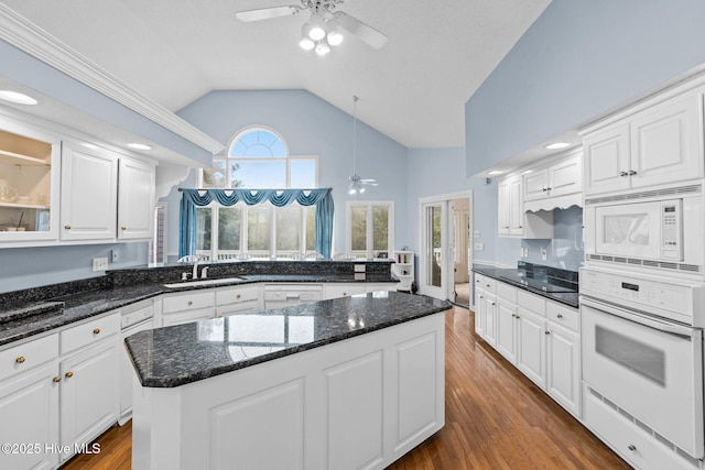 178 Edgewater Cir, Sunset Beach, NC 28468 - kitchen featuring a sink, a ceiling fan, white appliances, and dark wood-style floors