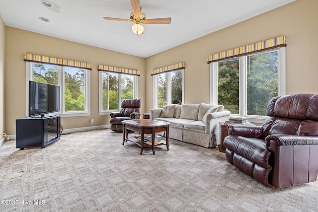 178 Edgewater Cir, Sunset Beach, NC 28468 - carpeted living area with baseboards and a ceiling fan