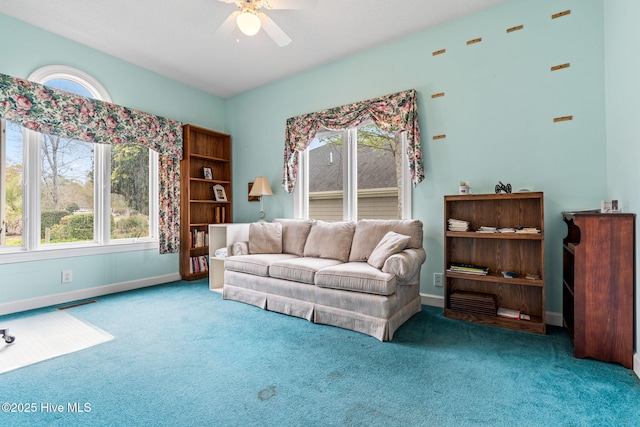 178 Edgewater Cir, Sunset Beach, NC 28468 - living room featuring carpet flooring, baseboards, and a ceiling fan