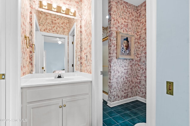 178 Edgewater Cir, Sunset Beach, NC 28468 - full bathroom with baseboards, a shower stall, vanity, and wallpapered walls
