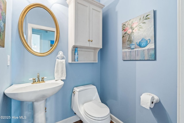 178 Edgewater Cir, Sunset Beach, NC 28468 - bathroom featuring toilet and baseboards