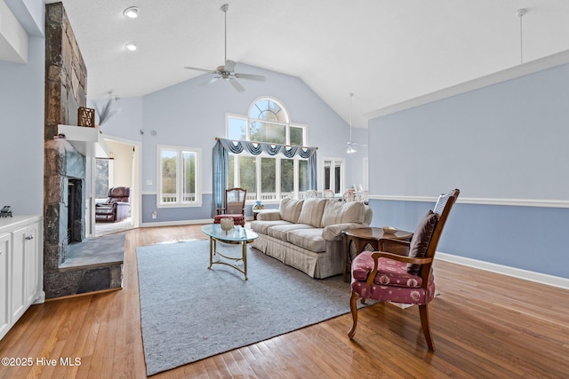 178 Edgewater Cir, Sunset Beach, NC 28468 - living area with light wood finished floors, high vaulted ceiling, ceiling fan, and a fireplace