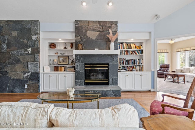 178 Edgewater Cir, Sunset Beach, NC 28468 - living area featuring a fireplace, built in features, and wood finished floors