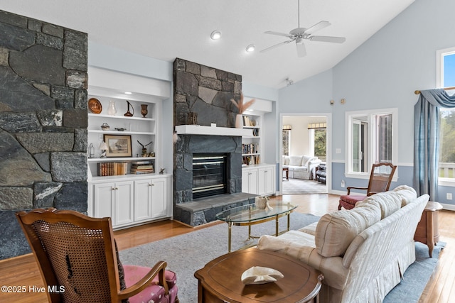 178 Edgewater Cir, Sunset Beach, NC 28468 - living room with built in features, wood finished floors, and a fireplace