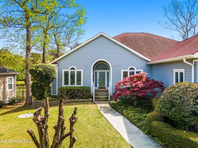178 Edgewater Cir, Sunset Beach, NC 28468 - view of front of home with a front yard