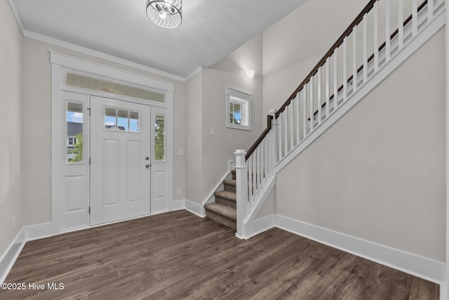 804 Winds Way, Aberdeen, NC 28315 - foyer featuring dark wood-type flooring, stairs, ornamental molding, and a chandelier
