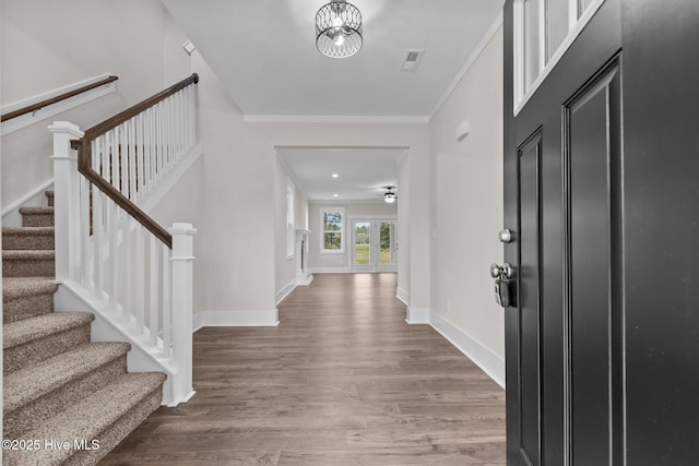 804 Winds Way, Aberdeen, NC 28315 - entrance foyer featuring wood finished floors, stairs, crown molding, and a ceiling fan