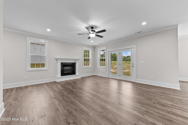 804 Winds Way, Aberdeen, NC 28315 - unfurnished living room featuring crown molding, ceiling fan, wood finished floors, a glass covered fireplace, and recessed lighting
