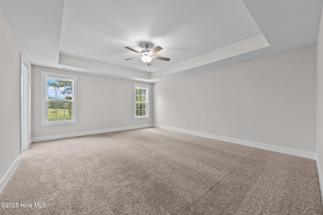 804 Winds Way, Aberdeen, NC 28315 - spare room featuring a tray ceiling, ceiling fan, and carpet