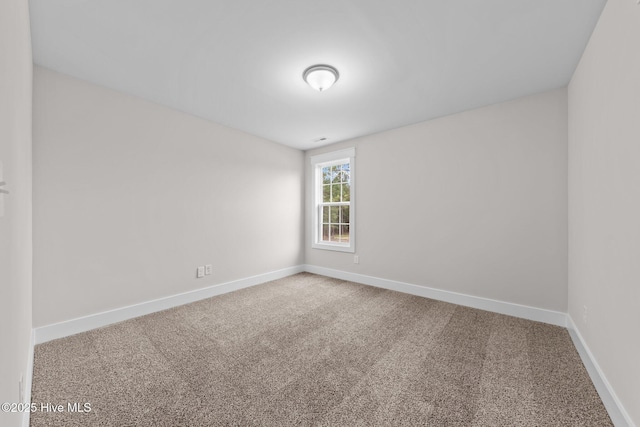 804 Winds Way, Aberdeen, NC 28315 - spare room featuring carpet flooring and baseboards